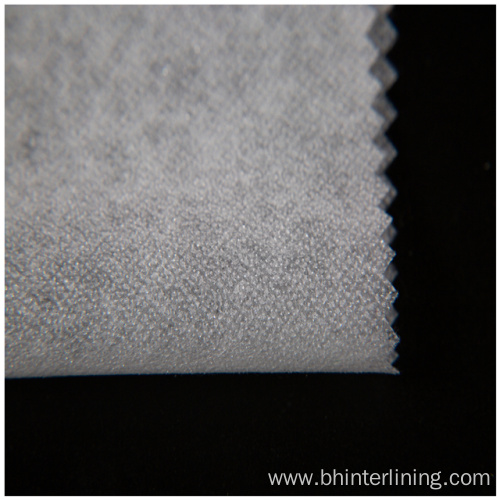 Soft and smooth feeling fusible nonwoven interlining fabric